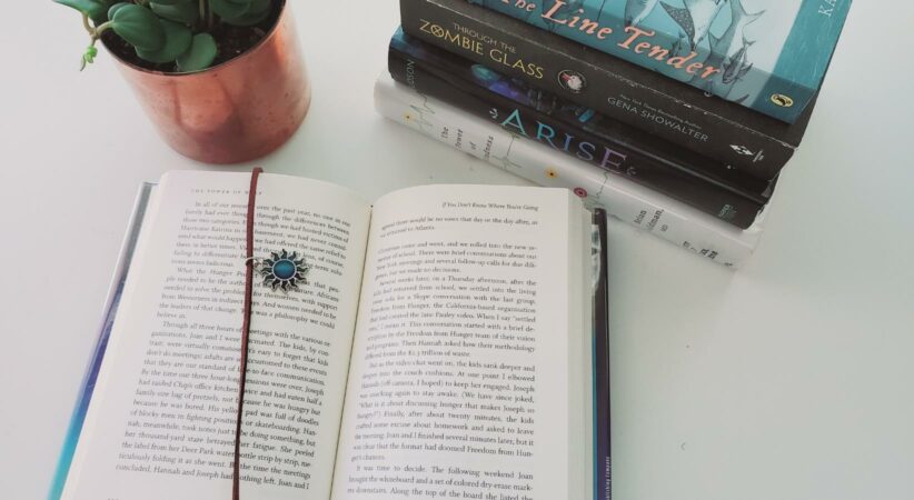 An open book with a bookmark on the page.